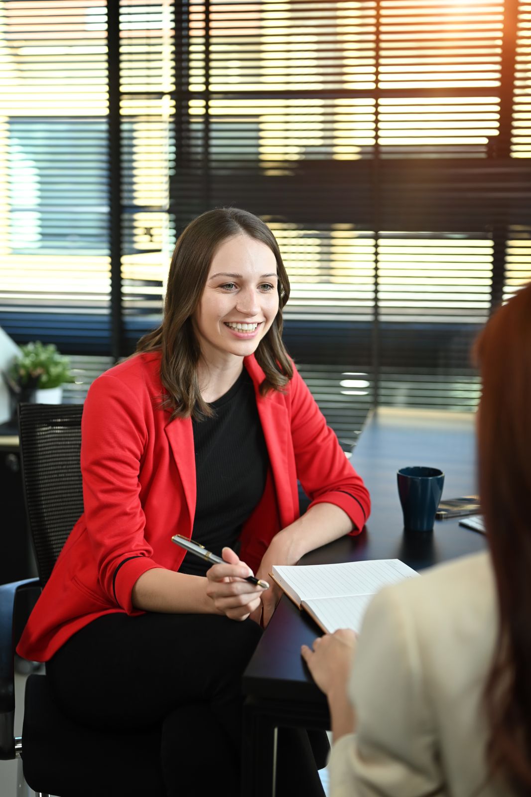 49660654_smiling-caucasian-female-hr-manager-interviewing-candidate-female-in-seating-area-of-modern-office